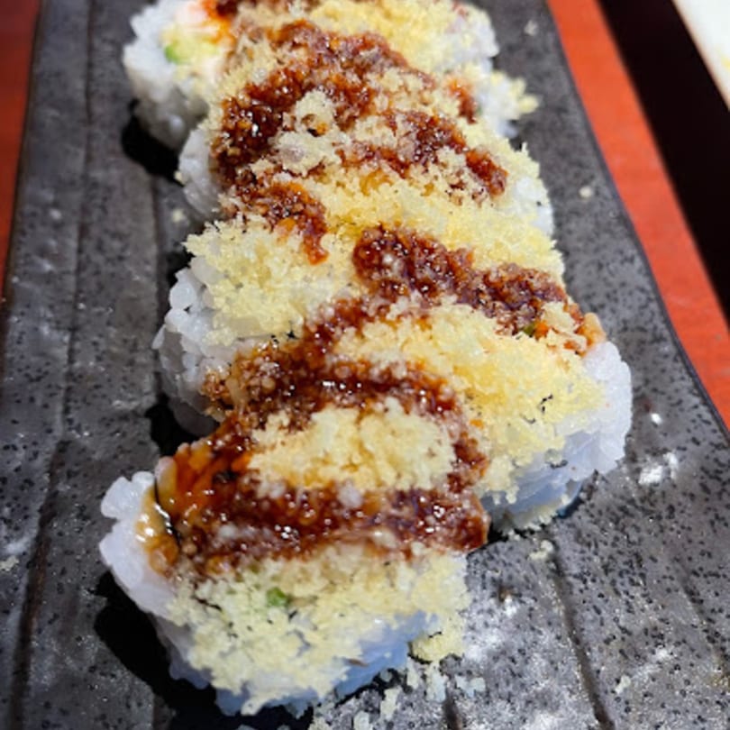 Mikado Ryotei's sushi rolls topped with crispy tempura flakes and sweet unagi sauce.